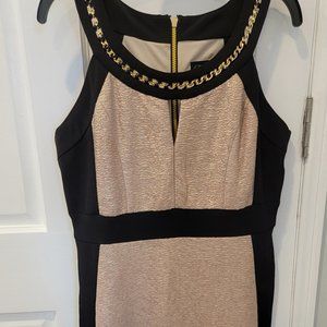 Form fitting black and gold trimmed dress
